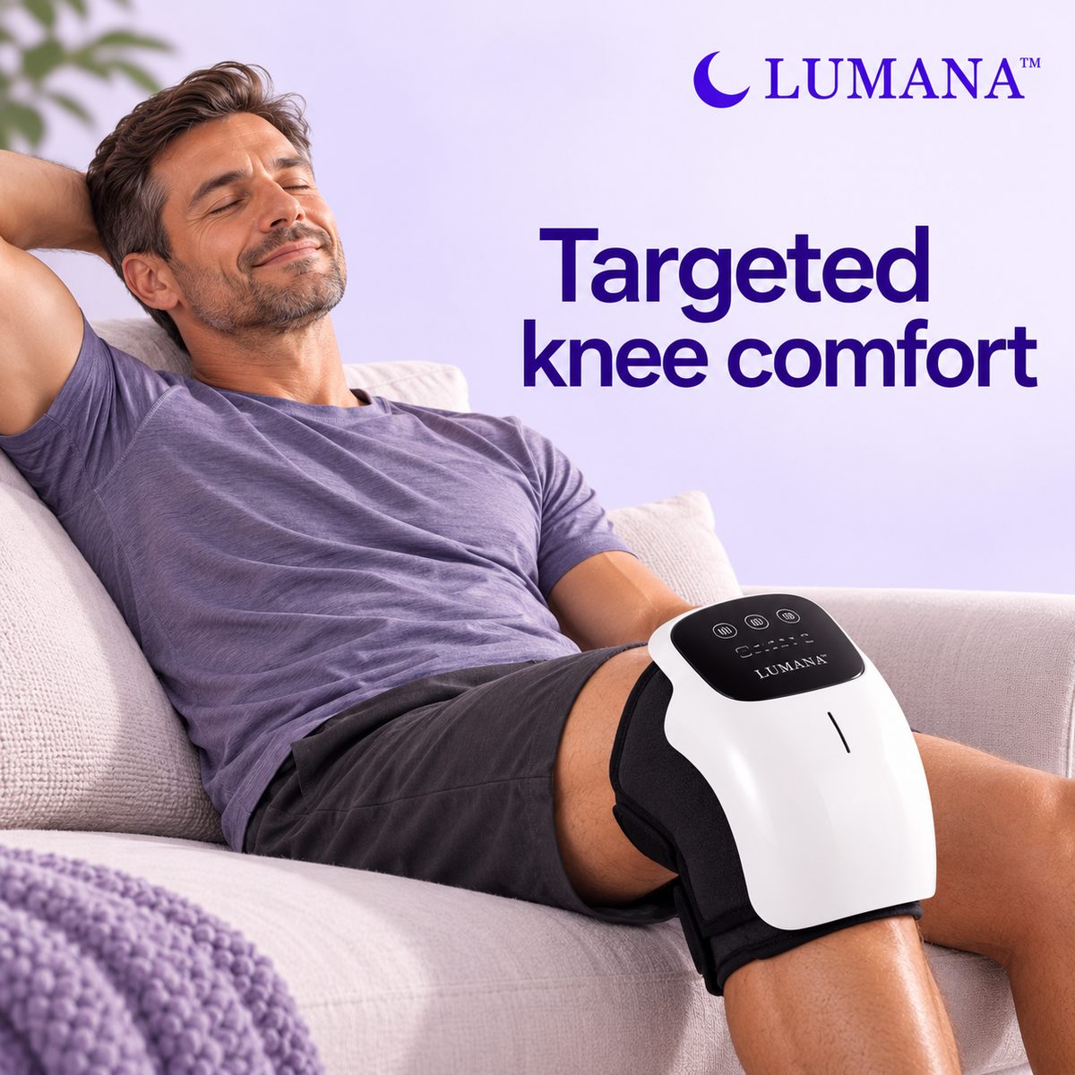 Man relaxing on a sofa wearing the LUMANA heated knee massager with touchscreen controls