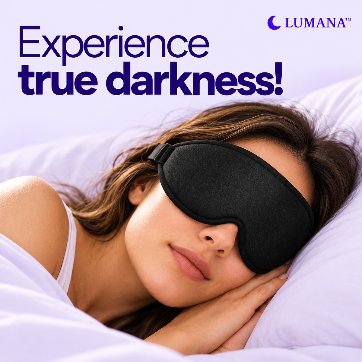 A woman sleeping peacefully in bed, wearing a black eye mask to block out light. The image features a soft purple background with the text 'Experience true darkness!' and the LUMANA brand logo in the top right corner.